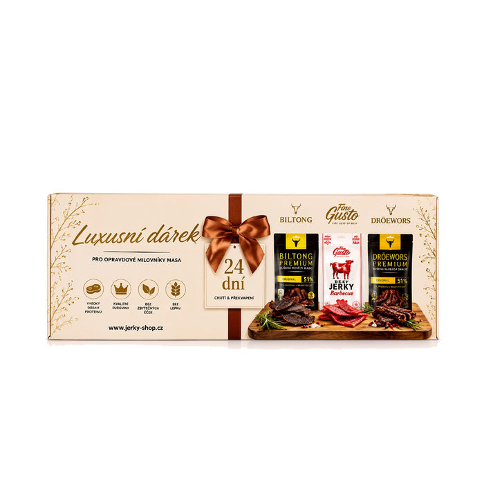 Fine Gusto Jerky Advent Calendar, 24 days of jerky, biltong and droewors, cream and gold box with copper bow print, front view on white