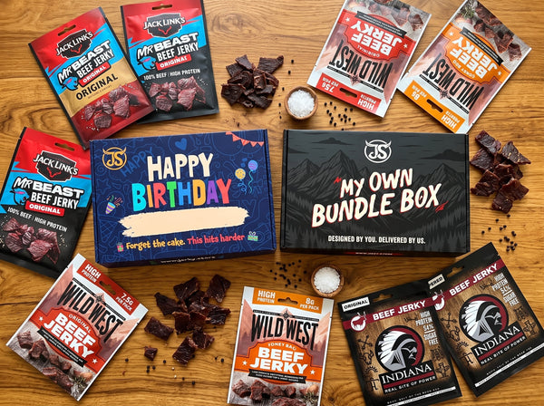 Jerky Store bundles flat-lay: the two gift boxes surrounded by Jack Link's, Wild West and Indiana jerky