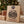 Jack Link's Advent Calendar leaning against kraft-wrapped gifts under a Christmas tree