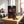 Meat Makers Beef Original Hot on a gym bench, with dumbbells, a towel and a water bottle in the background, AI-generated image