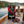 BeJerky Wagyu Jerky Original on the deck of a small sailboat on a lake in the evening sun, with a rope and thermos, AI-generated image