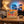 BiFi Chicken Roll 3-pack on a coffee table in the evening, with a game controller and a small bowl, AI-generated image