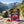 BiFi Tasty Bites Thai Hot Chili on a rock beside a mountain trail in the Alps, with a backpack and thermos, AI-generated image