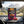 BiFi Tasty Bites Thai Hot Chili on the dashboard of a car at a mountain pass viewpoint, AI-generated image