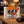BiFi Turkey 5-pack on a coffee table in the evening, with a game controller and a small bowl, AI-generated image