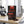 Biltong Premium Biltong Piri Piri on a gym bench, with dumbbells, a towel and a water bottle in the background, AI-generated image