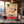 Cherky Beef Jerky Original on a wooden table in a mountain chalet, with a wool blanket, an enamel mug and snowy mountains outside, AI-generated image
