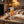Chokay Bio Snackbar Caramel Peanut on a coffee table in the evening, with a knitted blanket, a cup of tea and a book, AI-generated image