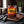 Cruga Biltong Chilli on a dark wooden cutting board on a kitchen counter in soft window light, AI-generated image