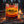 Cruga Biltong Chilli on a log by a campfire in a pine forest at dusk, with an enamel mug, AI-generated image