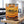 Cruga Biltong Original on a gym bench, with dumbbells, a towel and a water bottle in the background, AI-generated image