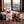 Fine Gusto Beef Jerky BBQ on a wooden table in a mountain cabin, with a wool blanket, an enamel mug and snowy mountains outside, AI-generated image