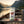 Fine Gusto Beef Jerky Pepper on the deck of a small boat on a fjord, with a rope and thermos in the evening sun, AI-generated image