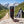 Franky's Best Beef Jerky Carolina Reaper on a rock beside a mountain trail in the Alps, with a backpack and thermos, AI-generated image