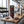 Franky's Best Beef Jerky Carolina Reaper on a gym bench, with dumbbells, a towel and a water bottle in the background, AI-generated image