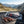 Franky's Best Beef Jerky Carolina Reaper on the dashboard of a car at a mountain pass viewpoint, AI-generated image