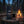 Franky's Best Beef Jerky Truffle on a log by a campfire in a pine forest at dusk, with an enamel mug, AI-generated image