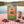 Grizzly Foods Beef Jerky Garden Greens on a checked picnic blanket by a lake on a summer day, with a steel cup and sunglasses, AI-generated image