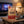 Grizzly Foods Vegan Jerky Burn Baby Burn on a coffee table in the evening, with a game controller and a small bowl, AI-generated image