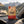 Grizzly Foods Vegan Jerky Burn Baby Burn on the dashboard of a car at a mountain pass viewpoint, AI-generated image