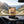 Grizzly Foods Vegan Jerky Cracked Pepper on the dashboard of a car at a mountain pass viewpoint, AI-generated image