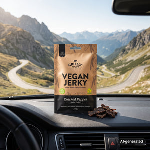 Grizzly Foods Vegan Jerky Cracked Pepper on the dashboard of a car at a mountain pass viewpoint, AI-generated image