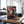 Indiana Biltong Original on a gym bench, with dumbbells, a towel and a water bottle in the background, AI-generated image