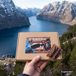 Hand holding Indiana Cut Your Own Biltong Box in front of a fjord landscape, AI-generated image
