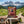Indiana Soft Beef Jerky Original on a rock beside a mountain trail in the Alps, with a backpack and thermos, AI-generated image