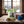 Indiana Vegan Hot & Sweet on a wooden table in a mountain cabin, with a wool blanket, an enamel mug and snowy mountains outside, AI-generated image