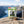 Indiana Vegan Hot & Sweet on a rock beside a mountain trail above a Norwegian fjord, with a backpack and thermos, AI-generated image
