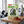 Indiana Vegan Hot & Sweet on a gym bench, with dumbbells, a towel and a water bottle in the background, AI-generated image