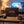 Jack Link's Gift Box on a coffee table in the evening, with a game controller and a small bowl, AI-generated image