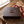 Jack Link's Gift Box on a table next to torn gift wrapping paper and a ribbon, AI-generated image