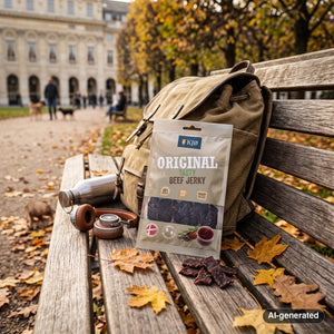 KJØ Tasty Beef Jerky sticking out of a backpack on a park bench in autumn, with a water bottle and headphones, AI-generated image