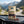 KJØ Tasty Beef Jerky on the dashboard of a car at a mountain pass viewpoint, AI-generated image