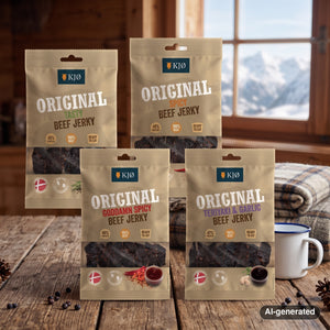 KJØ Mixed Pack on a wooden table in a mountain chalet, with a wool blanket, an enamel mug and snowy mountains outside, AI-generated image