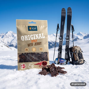 KJØ Spicy Beef Jerky in the snow next to touring skis and poles on a sunny winter day in the Alps, AI-generated image