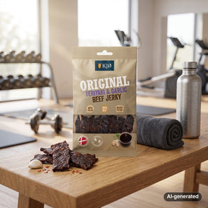 KJØ Teriyaki & Garlic Beef Jerky on a gym bench, with dumbbells, a towel and a water bottle in the background, AI-generated image