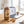 KoRo Apple Chips Elstar on a desk next to a laptop, a cup of coffee and a notebook, AI-generated image