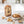 KoRo Apple Chips Elstar on a light marble kitchen counter with a small bowl of the fruit, AI-generated image