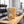 KoRo Banana Stripes on a gym bench, with dumbbells, a towel and a water bottle in the background, AI-generated image