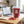 KoRo Freeze-Dried Raspberries on a desk next to a laptop, a cup of coffee and a notebook, AI-generated image