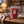 KoRo Freeze-Dried Raspberries on a coffee table in the evening, with a knitted blanket, a cup of tea and a book, AI-generated image