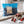 KoRo Freeze-Dried Strawberries in Milk Chocolate on a light marble kitchen counter with a small bowl of the fruit, AI-generated image