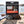 Kuivalihakundi Beef Jerky Scorpion on a smooth coastal rock by the sea, with a towel and sunglasses, AI-generated image
