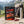 Leon Jerky Beef Hot & Sweet on a rock beside a mountain trail in the Alps, with a backpack and thermos, AI-generated image