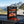 Leon Jerky Beef Hot & Sweet on the dashboard of a car at a mountain pass viewpoint, AI-generated image