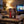 Meat Makers Pork Bites Original on a coffee table in the evening, with a game controller and a small bowl, AI-generated image