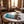 Mr. Beast Feastables Almond on a marble cafe table next to a cappuccino, AI-generated image
